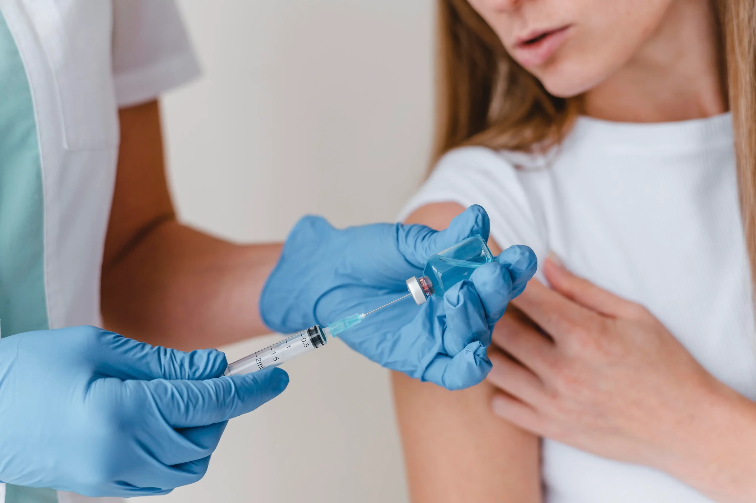 A pharmacist preparing a travel vaccination